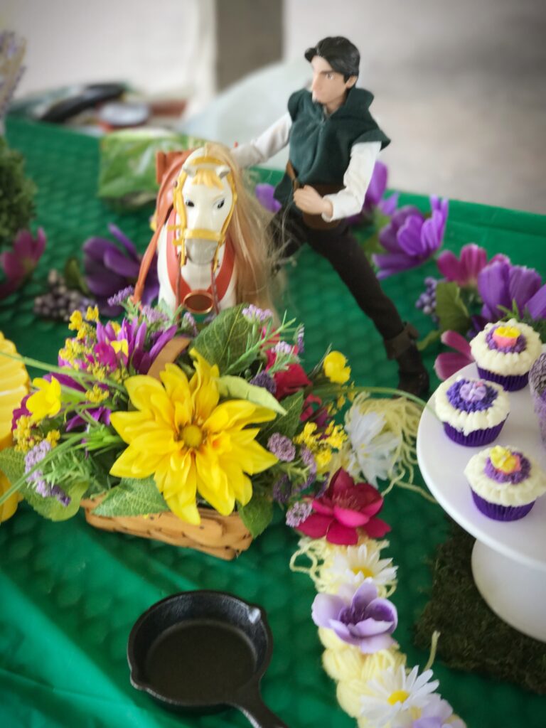 Rapunzel doll birthday party tower table view buttercream cake DIY flynn rider Tangled maximus horse