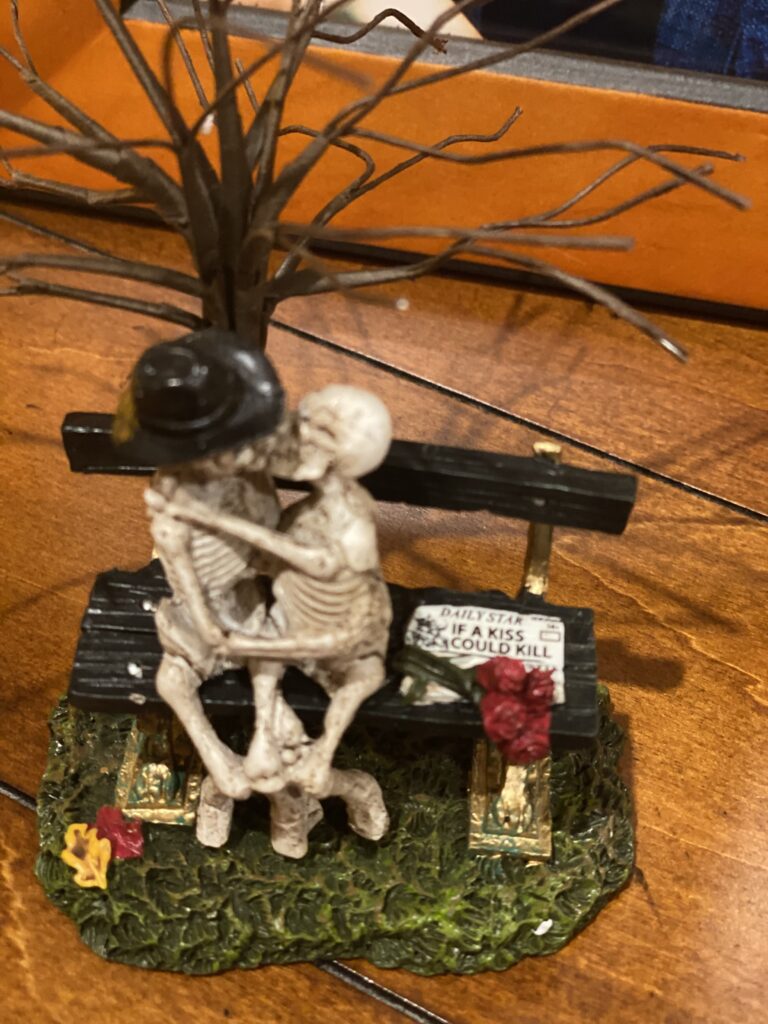 Halloween Department 56 skeletons kissing on park bench if a kiss could kill
