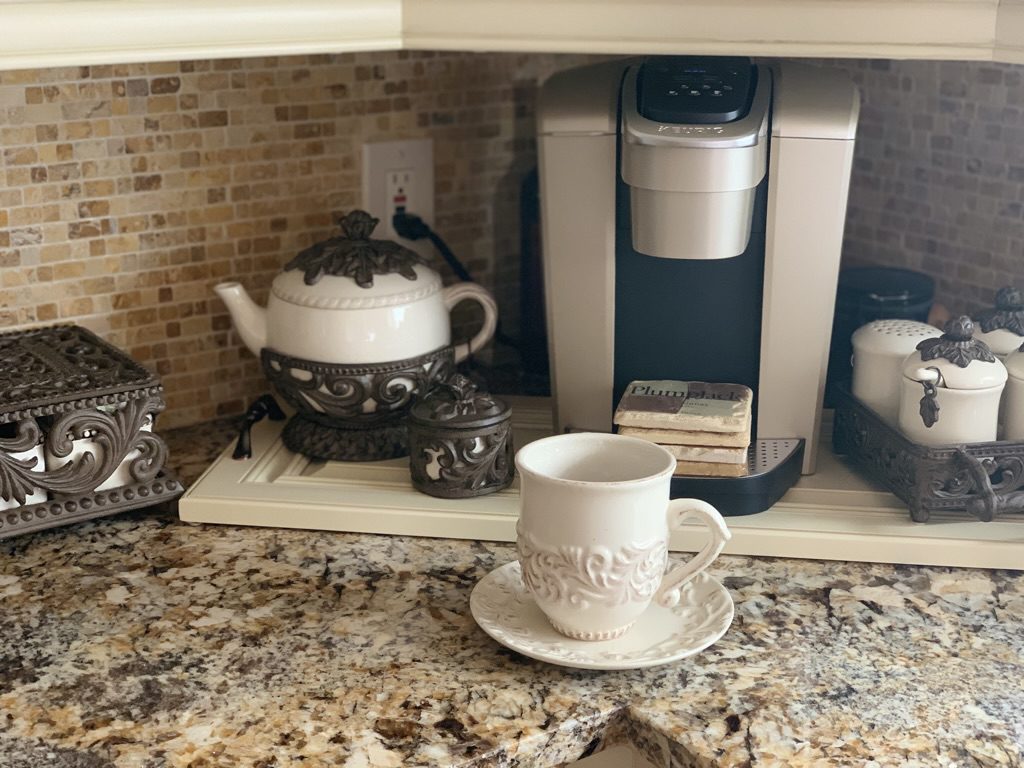 Kitchen coffee bar with Keurig K Cup gold single serve coffee maker gg collection acanthus mugs teapot