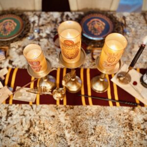 Hogwarts Harry Potter Quidditch Candles LED flickering soft glow on brass candle sticks golden snitch from pottery barn teen