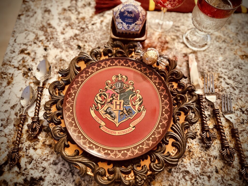 Hogwarts Harry Potter Quidditch Candles LED flickering soft glow on brass candle sticks table centerpiece hogwarts melamine house crest plates
