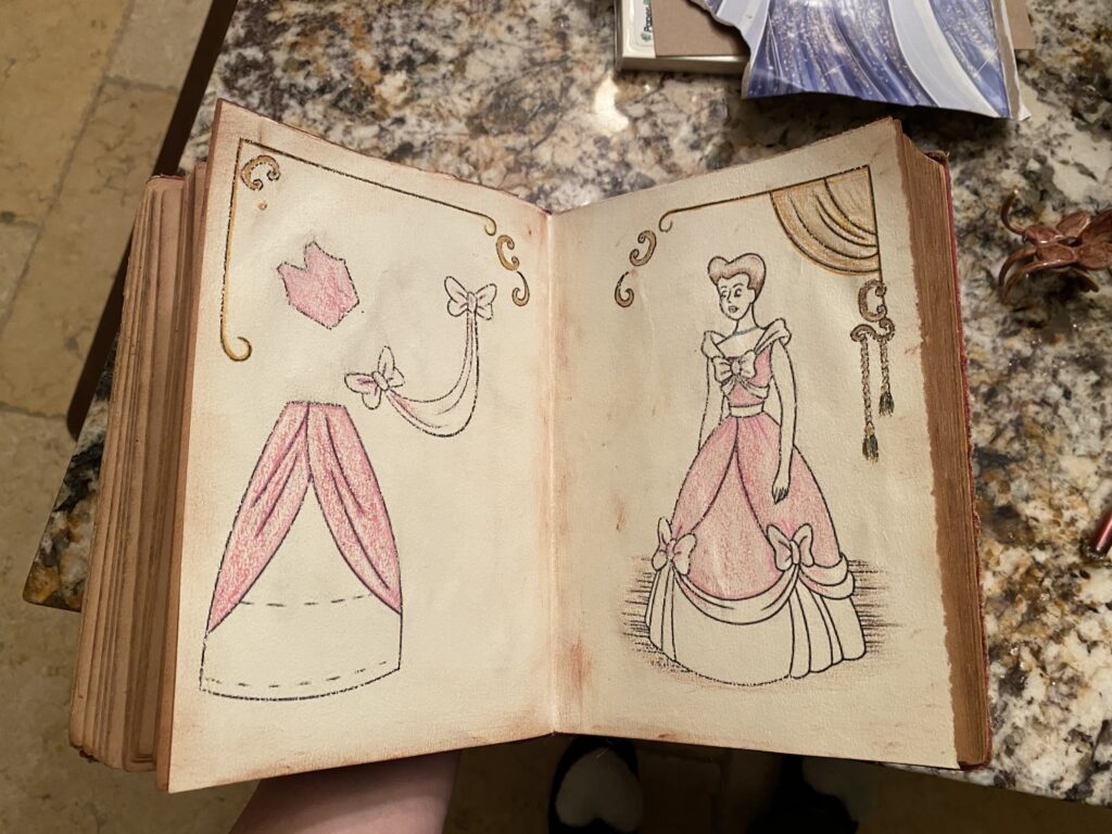 DIY Cinderella sewing book at the kitchen bar doing crafts mommy and me